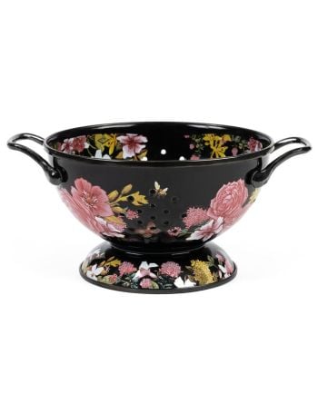 Black metal floral colander with side handles and pedestal base on a plain background.