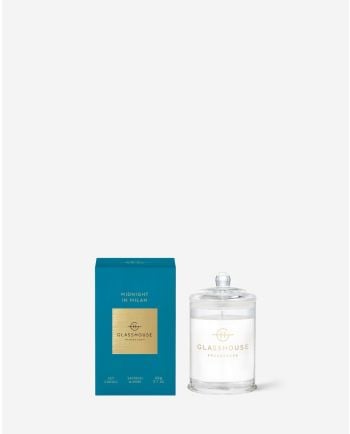 Glasshouse Fragrances Midnight in Milan soy candle with teal gift box and white glass jar with lid.