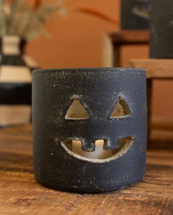 short black clay jack-o-lantern