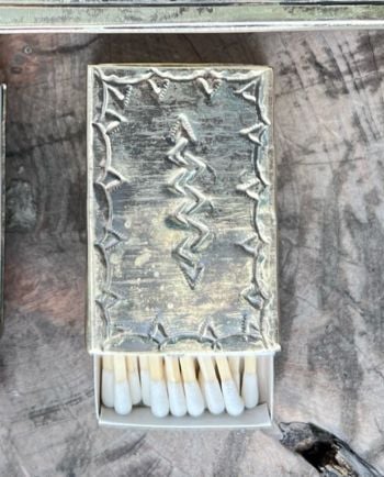small stamped silver matchbox cover