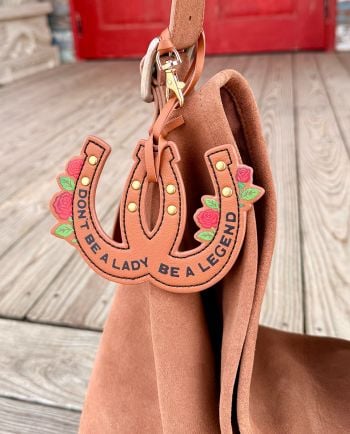 don't be a lady, be a legend jg horseshoe bag charm