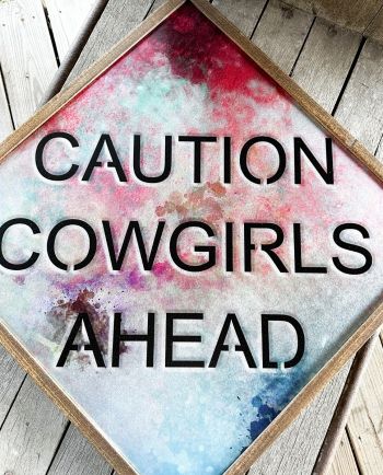 caution cowgirls ahead metal sign